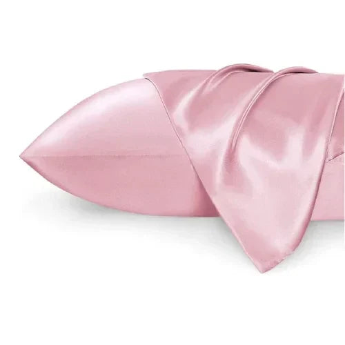 Pink silk pillowcase for ergonomic pillow, with a smooth and shiny finish.